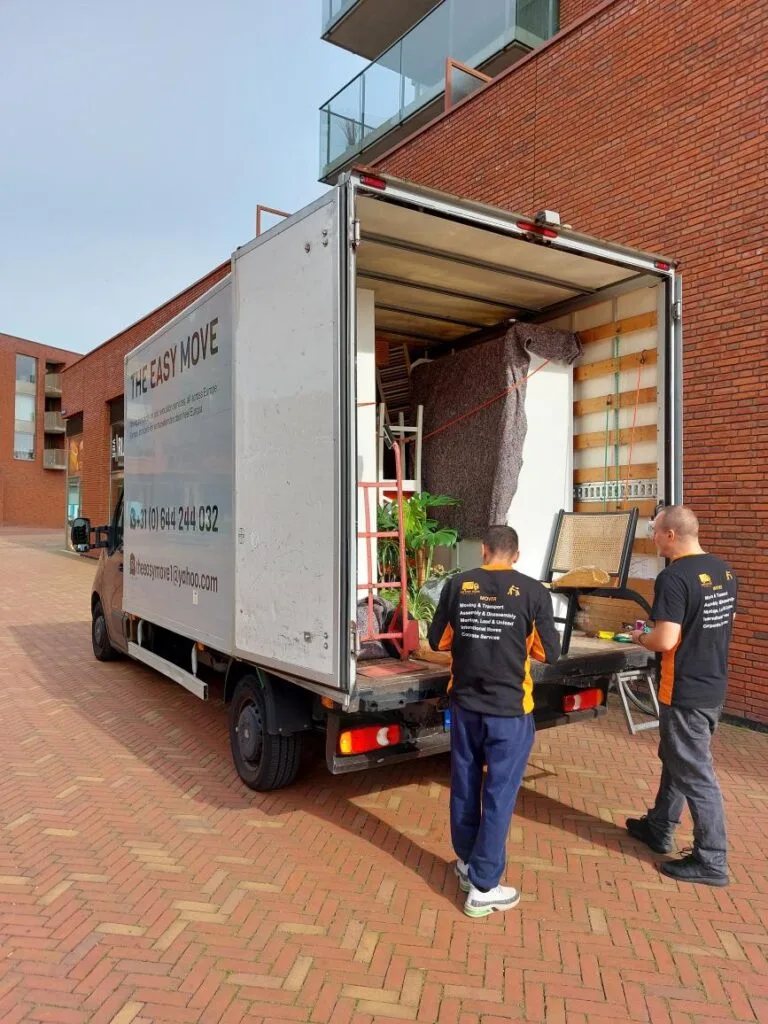 Driver standing by amsterdam moving van ready for full-service moving