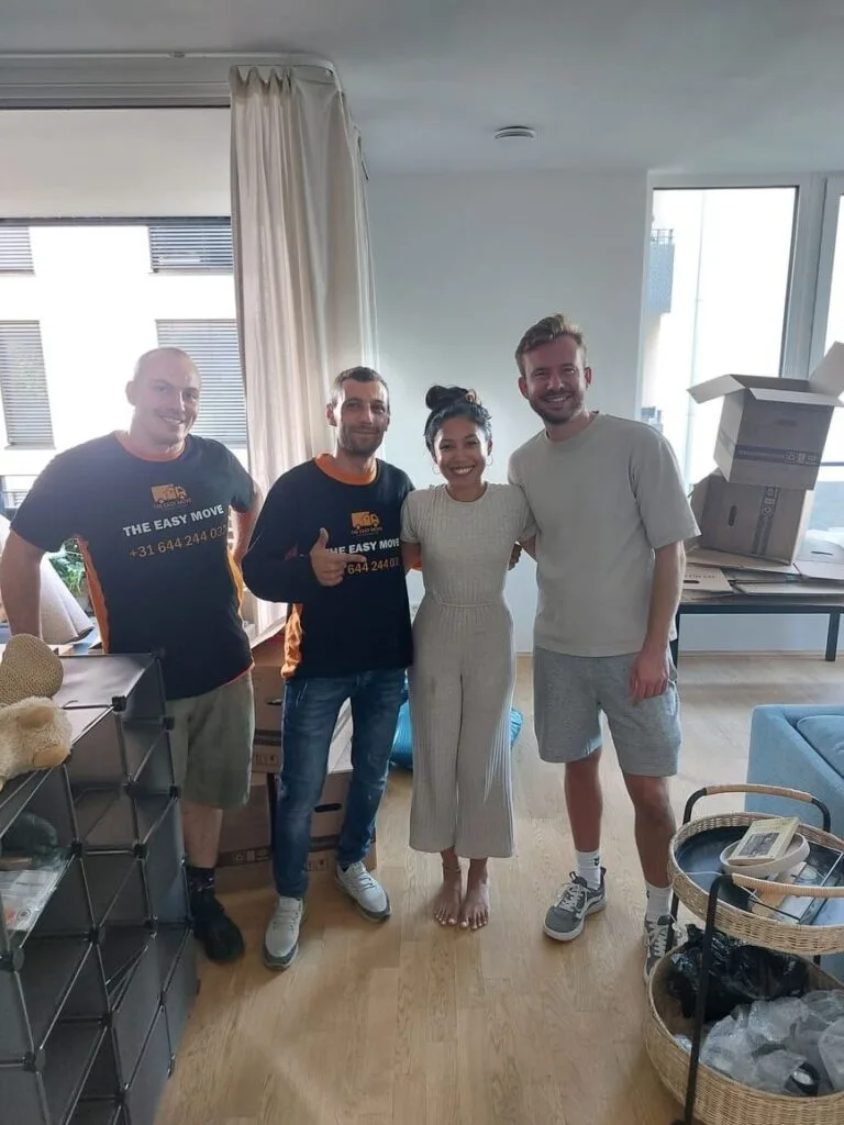 Happy family with movers in Dortmund